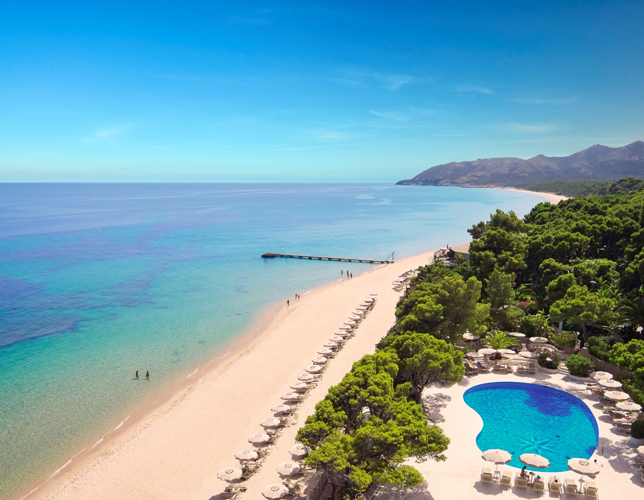 small circle pool with loungers, access to sandy beach with ocean views,