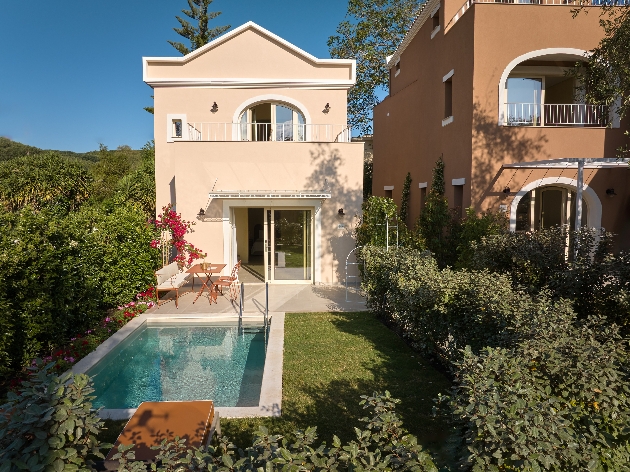mini villa with pink walls white features own pool